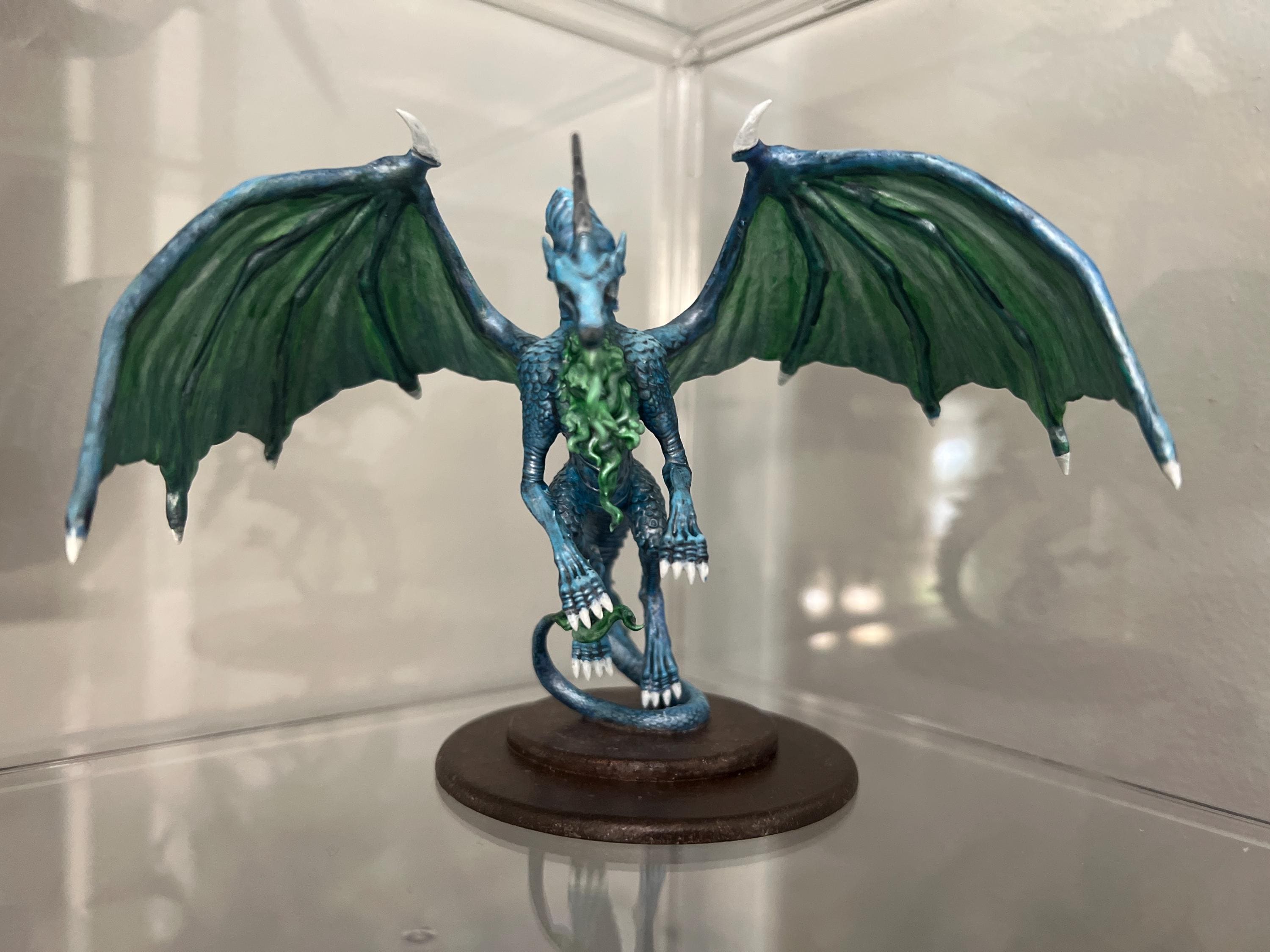 Customer photo of a moonstone dragon miniature from an Etsy order